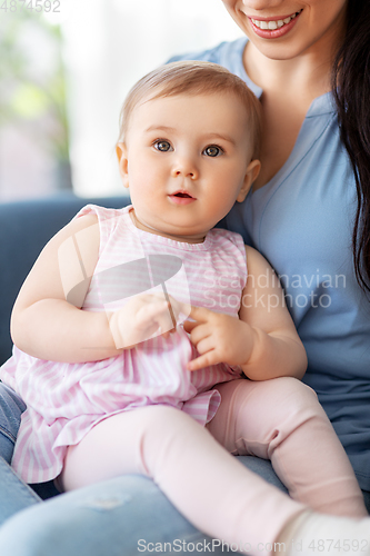 Image of portrait of little baby girl with happy mother