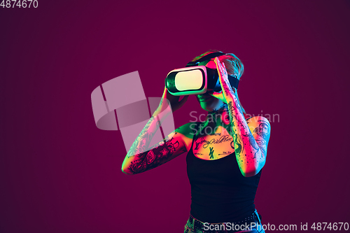 Image of Portrait of young caucasian woman on purple background with copyspace, unusual and freaky appearance