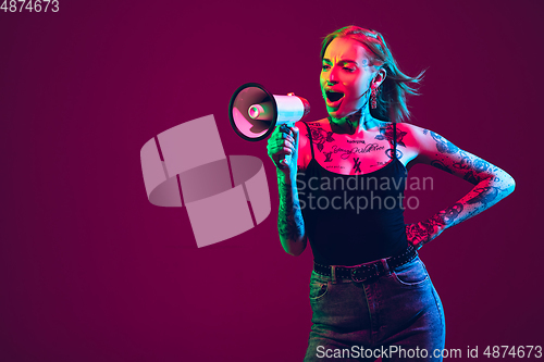 Image of Portrait of young caucasian woman on purple background with copyspace, unusual and freaky appearance