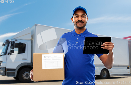 Image of indian delivery man with tablet pc and parcel box