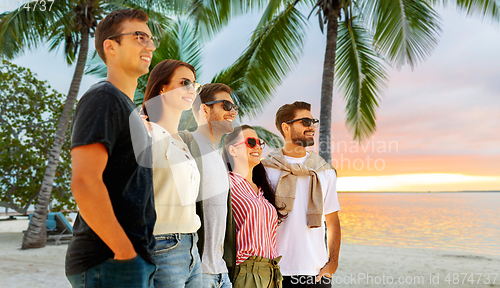 Image of happy friends on summer beach