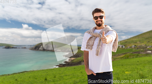 Image of happy man showing thumbs up in ireland