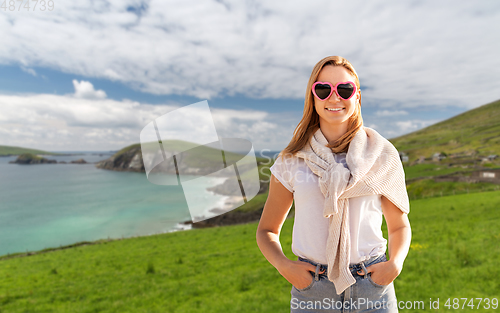 Image of woman wearing heart-shaped sunglasses in ireland