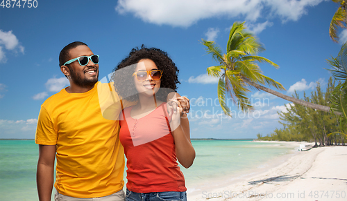 Image of happy african american couple in sunglasses