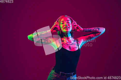 Image of Portrait of young caucasian woman on purple background with copyspace, unusual and freaky appearance