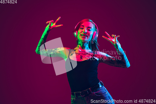 Image of Portrait of young caucasian woman on purple background with copyspace, unusual and freaky appearance