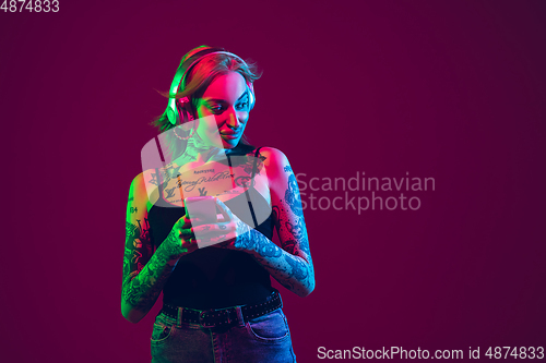 Image of Portrait of young caucasian woman on purple background with copyspace, unusual and freaky appearance