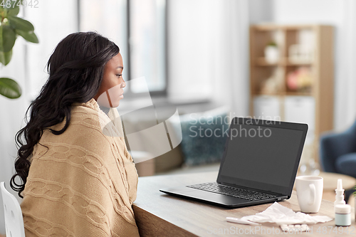 Image of sick woman having video call on laptop at home