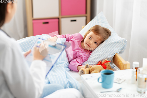 Image of doctor with clipboard and sick girl in bed at home