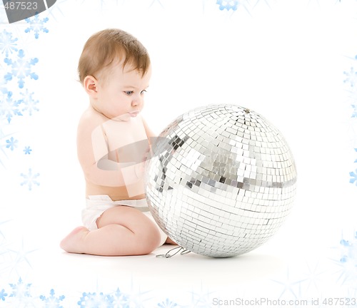 Image of baby boy with big disco ball