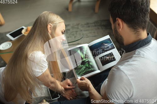 Image of Mother, father and daughter at home having fun, comfort and cozy concept