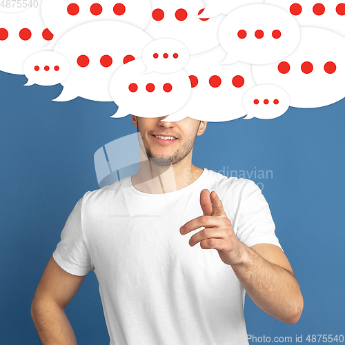 Image of Man with big speech bubbles on his head like a hairstyle