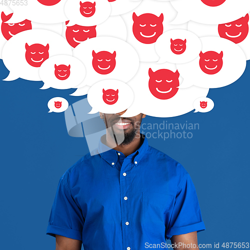 Image of Man with big speech bubbles on his head like a hairstyle