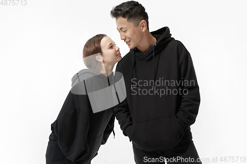 Image of Trendy fashionable couple isolated on white studio background