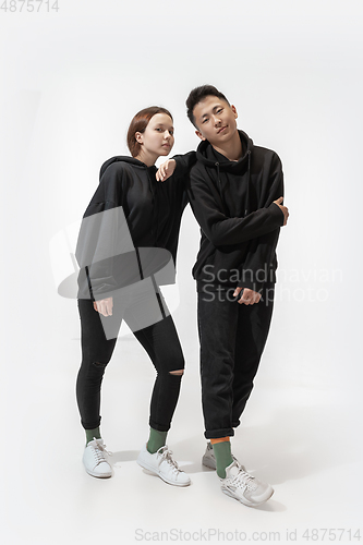 Image of Trendy fashionable couple isolated on white studio background