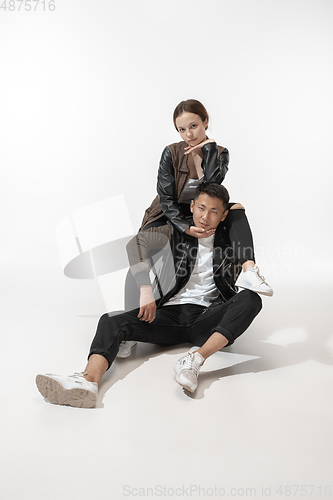 Image of Trendy fashionable couple isolated on white studio background