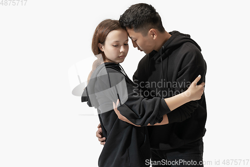 Image of Trendy fashionable couple isolated on white studio background