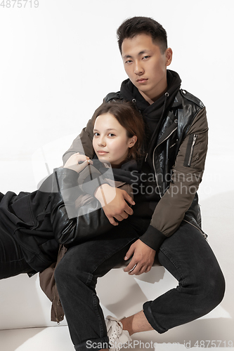 Image of Trendy fashionable couple isolated on white studio background