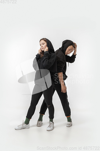 Image of Trendy fashionable couple isolated on white studio background