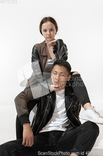 Image of Trendy fashionable couple isolated on white studio background