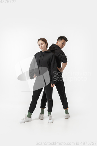 Image of Trendy fashionable couple isolated on white studio background