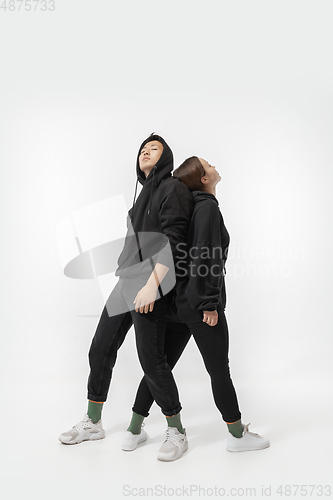 Image of Trendy fashionable couple isolated on white studio background