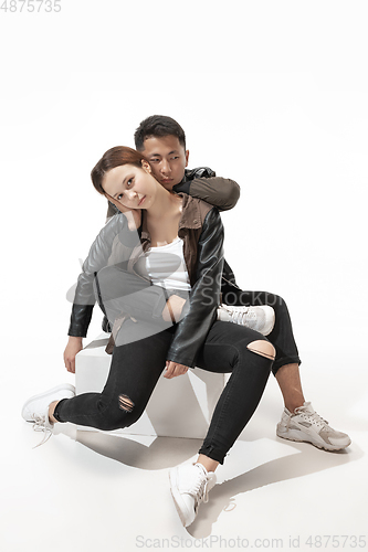 Image of Trendy fashionable couple isolated on white studio background