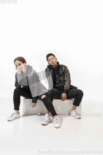 Image of Trendy fashionable couple isolated on white studio background