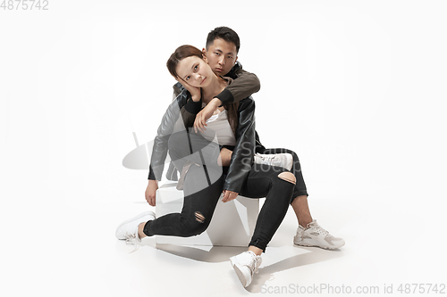 Image of Trendy fashionable couple isolated on white studio background