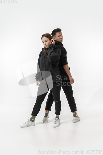 Image of Trendy fashionable couple isolated on white studio background