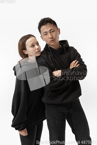 Image of Trendy fashionable couple isolated on white studio background