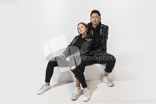 Image of Trendy fashionable couple isolated on white studio background