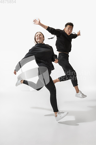 Image of Trendy fashionable couple isolated on white studio background