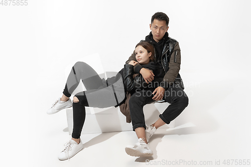 Image of Trendy fashionable couple isolated on white studio background