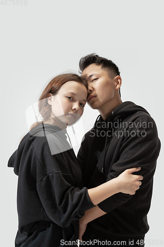 Image of Trendy fashionable couple isolated on white studio background