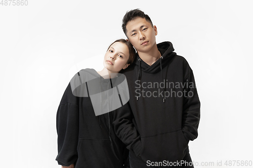 Image of Trendy fashionable couple isolated on white studio background