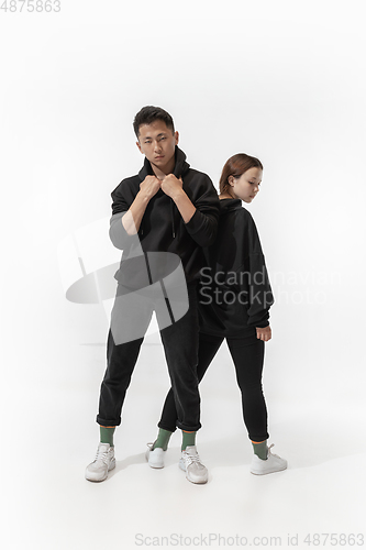 Image of Trendy fashionable couple isolated on white studio background