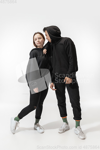 Image of Trendy fashionable couple isolated on white studio background