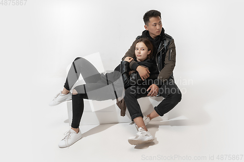 Image of Trendy fashionable couple isolated on white studio background