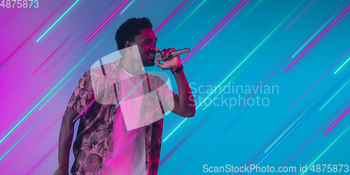 Image of Neon lighted, colored portrait with neon lines, flyer, proposal
