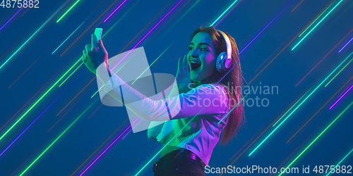 Image of Neon lighted, colored portrait with neon lines, flyer, proposal