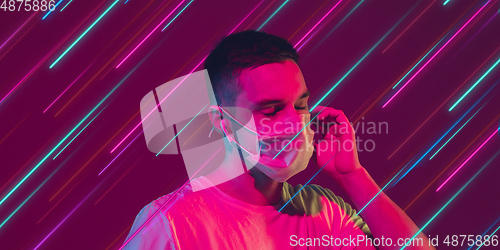 Image of Neon lighted, colored portrait with neon lines, flyer, proposal