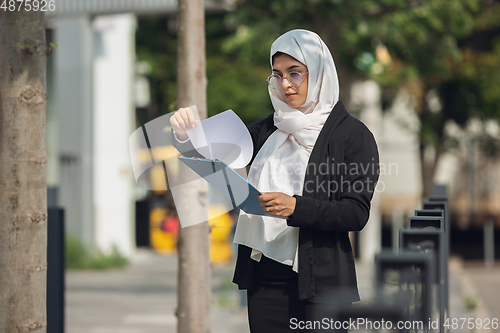 Image of Beautiful muslim successful businesswoman portrait, confident happy CEO