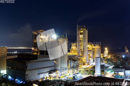 Image of Concrete cement factory at night