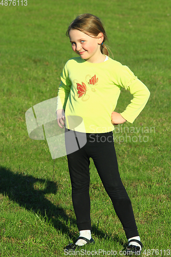 Image of little girl standing at in the business position