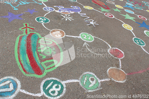 Image of childish drawings as a game on the asphalt