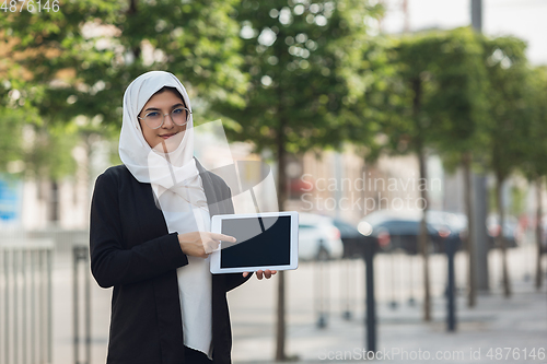 Image of Beautiful muslim successful businesswoman portrait, confident happy CEO