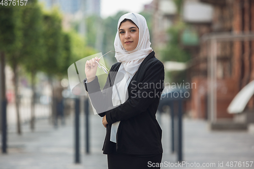 Image of Beautiful muslim successful businesswoman portrait, confident happy CEO