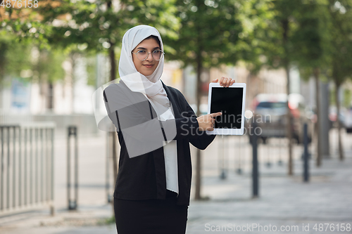 Image of Beautiful muslim successful businesswoman portrait, confident happy CEO