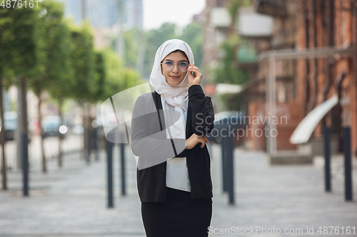 Image of Beautiful muslim successful businesswoman portrait, confident happy CEO